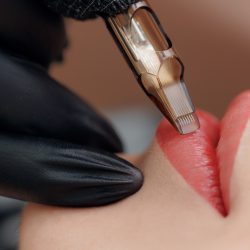 Procedure,Permanent,Makeup,In,Beauty,Salon,,Tattoo,Machine,With,Red