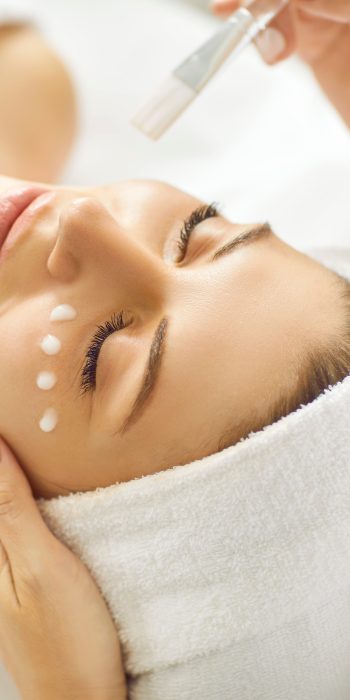 Professional,Beautician,Doing,Facial,Treatment,,Applying,Cleansing,,Moisturizing,,Nourishing,And