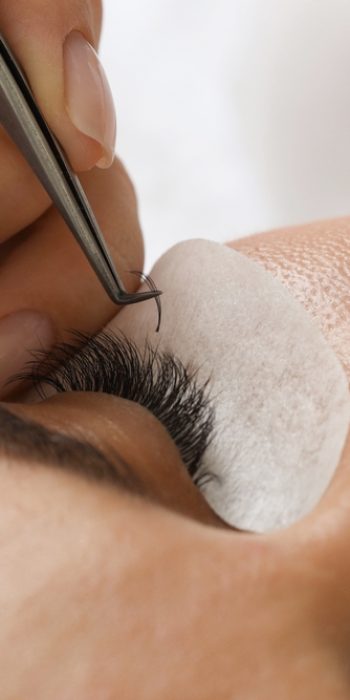 Woman,Undergoing,Lash,Extensions,Procedure,In,Beauty,Salon,,Closeup